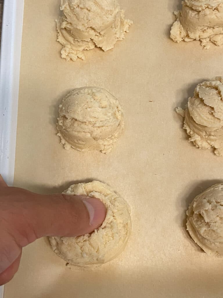 process shot of creating divot in dough