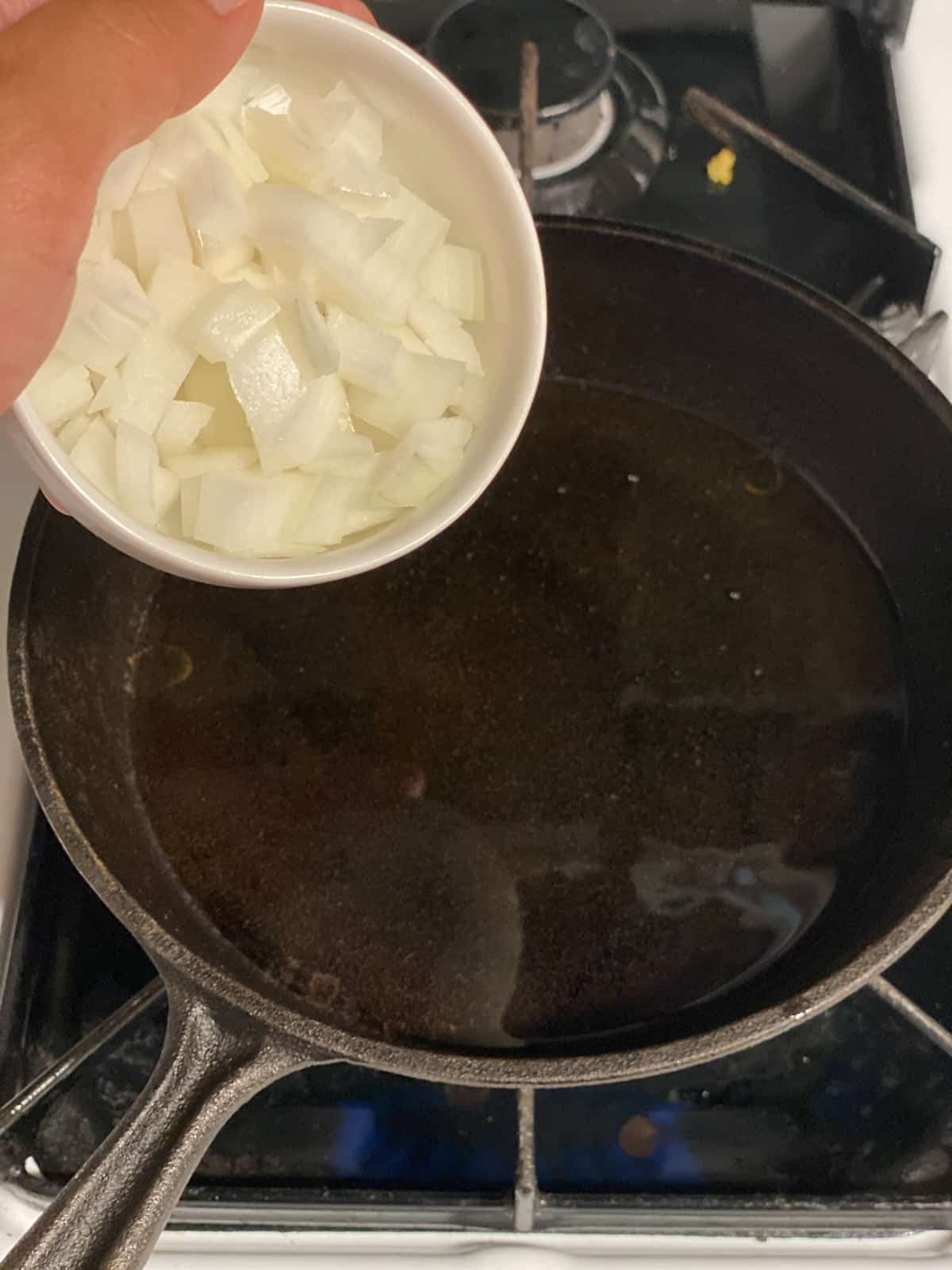 process of adding onion to pan