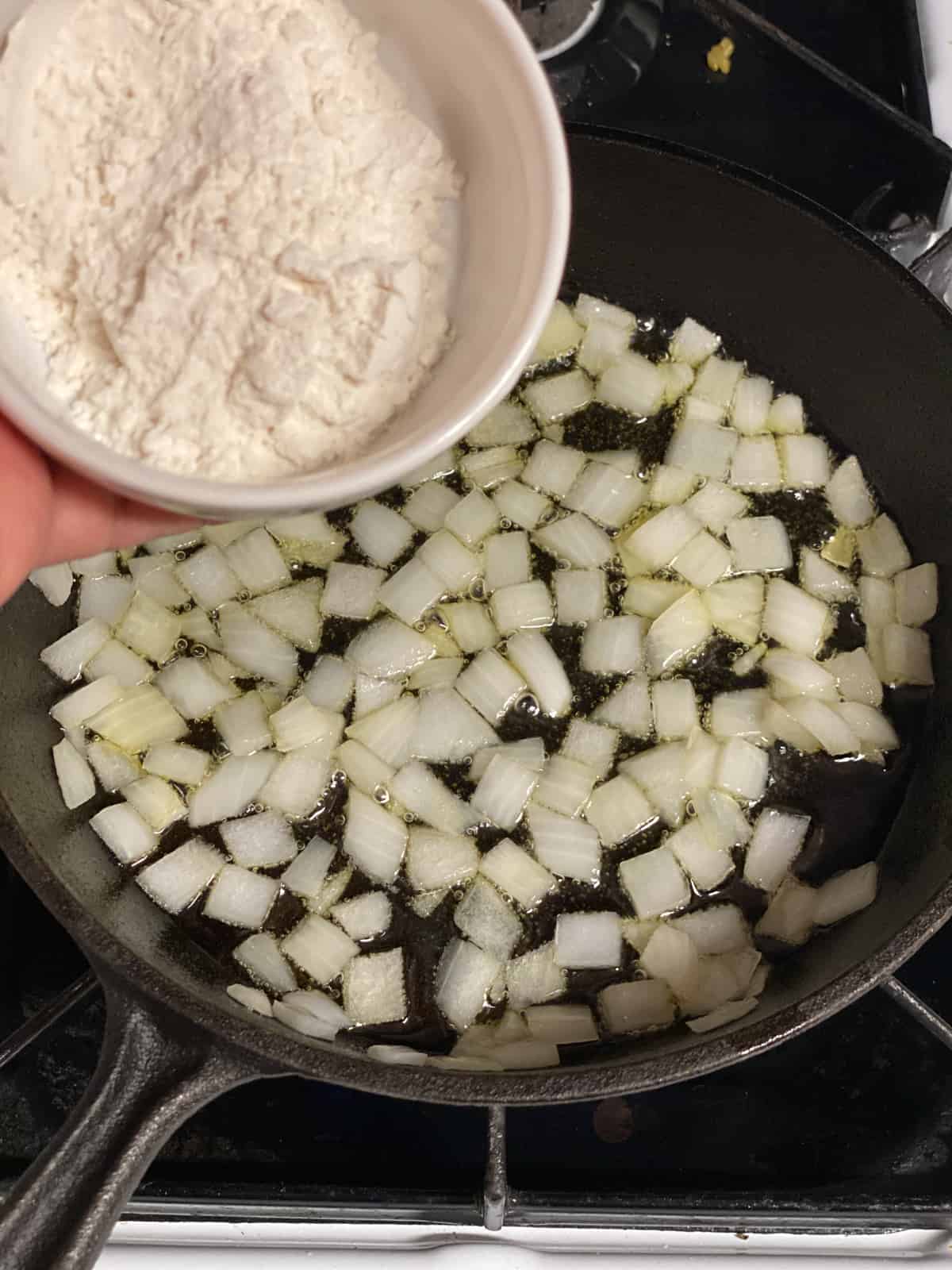 process of adding flour to pan