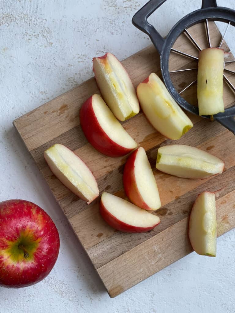 process shot of slicing apples on a cutting board