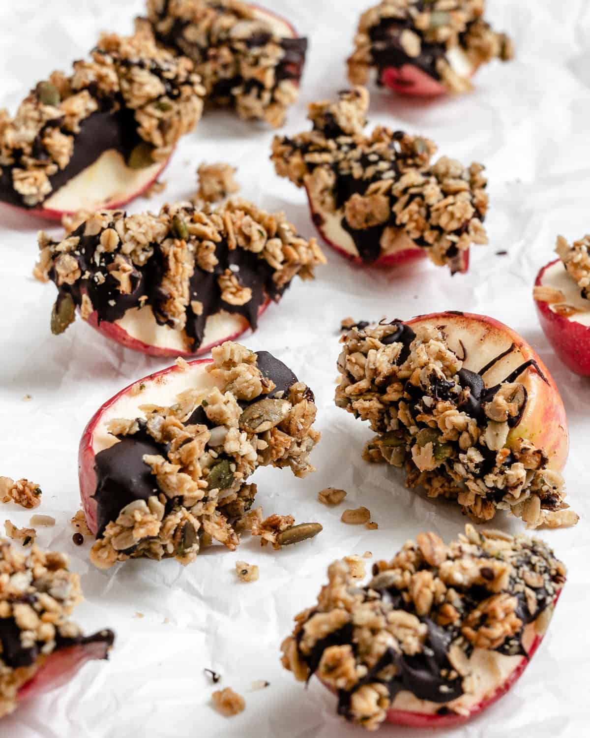 several completed Healthy Apple Snacks with Granola against a white surface