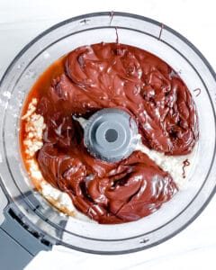 process of blending pie filling in blender against white background