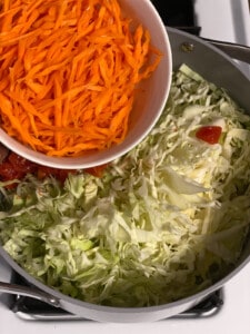 process shot of adding carrots to pan