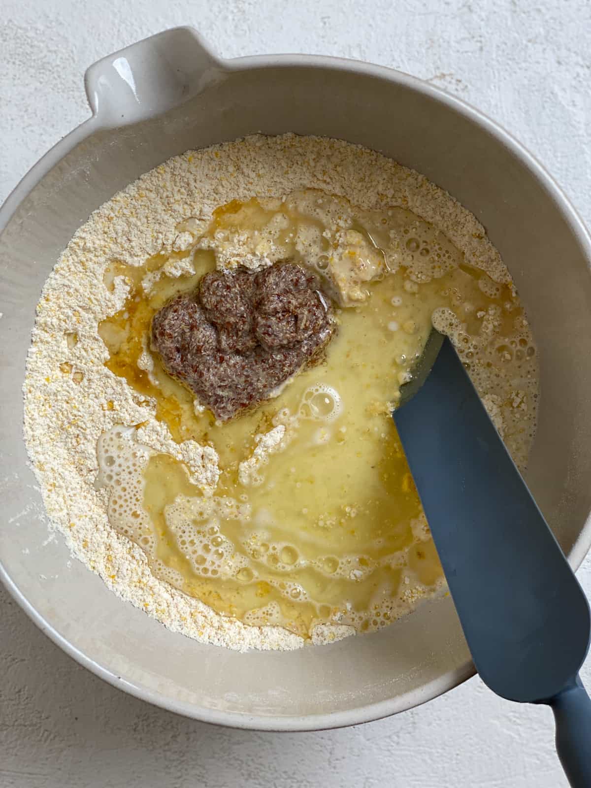 process shot of mixing ingredients together in bowl