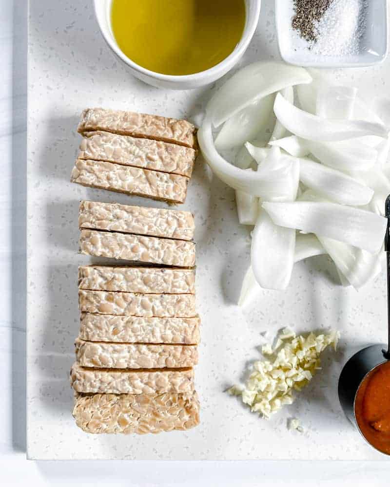 BBQ Tempeh Ingredients cut and diced on a white surface