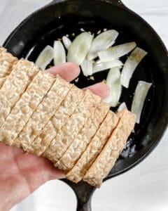 process showing tempeh being added to the pan
