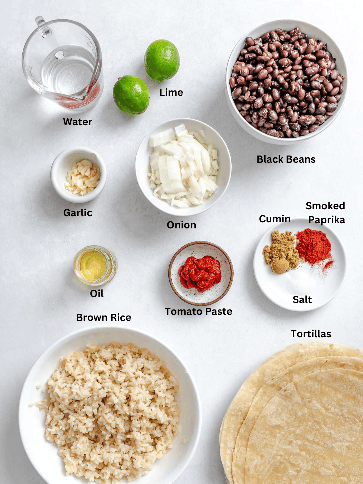 Ingredients for Rice and Black Bean Burrito (Freezer Friendly) measured out on a white surface.
