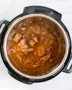 process of jackfruit carnitas in the slow cooker against white background