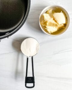 process showing ingredients next to a black pan