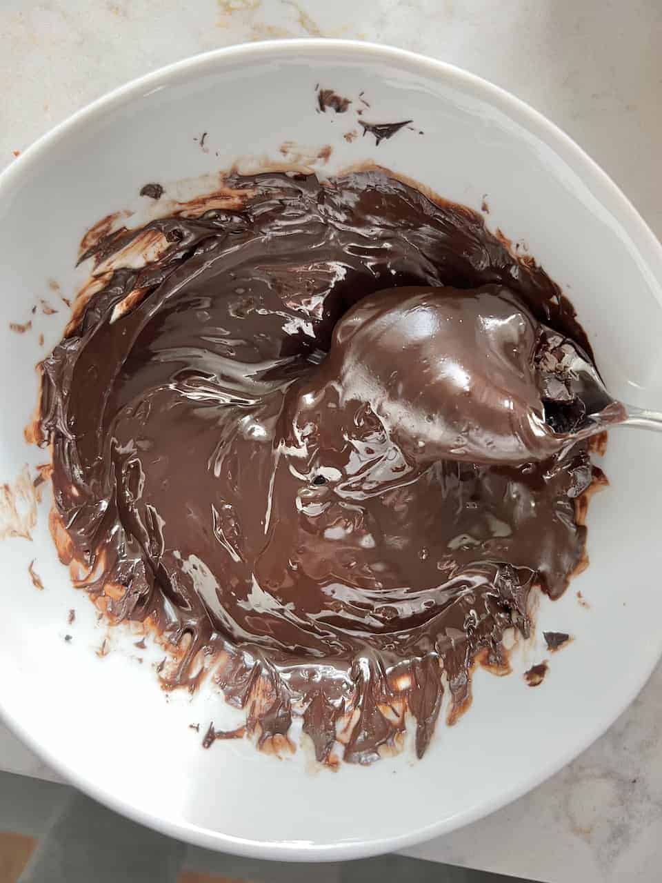 melted vegan chocolate in a white bowl