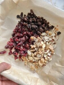 mixture of dried fruits and nuts on parchment paper