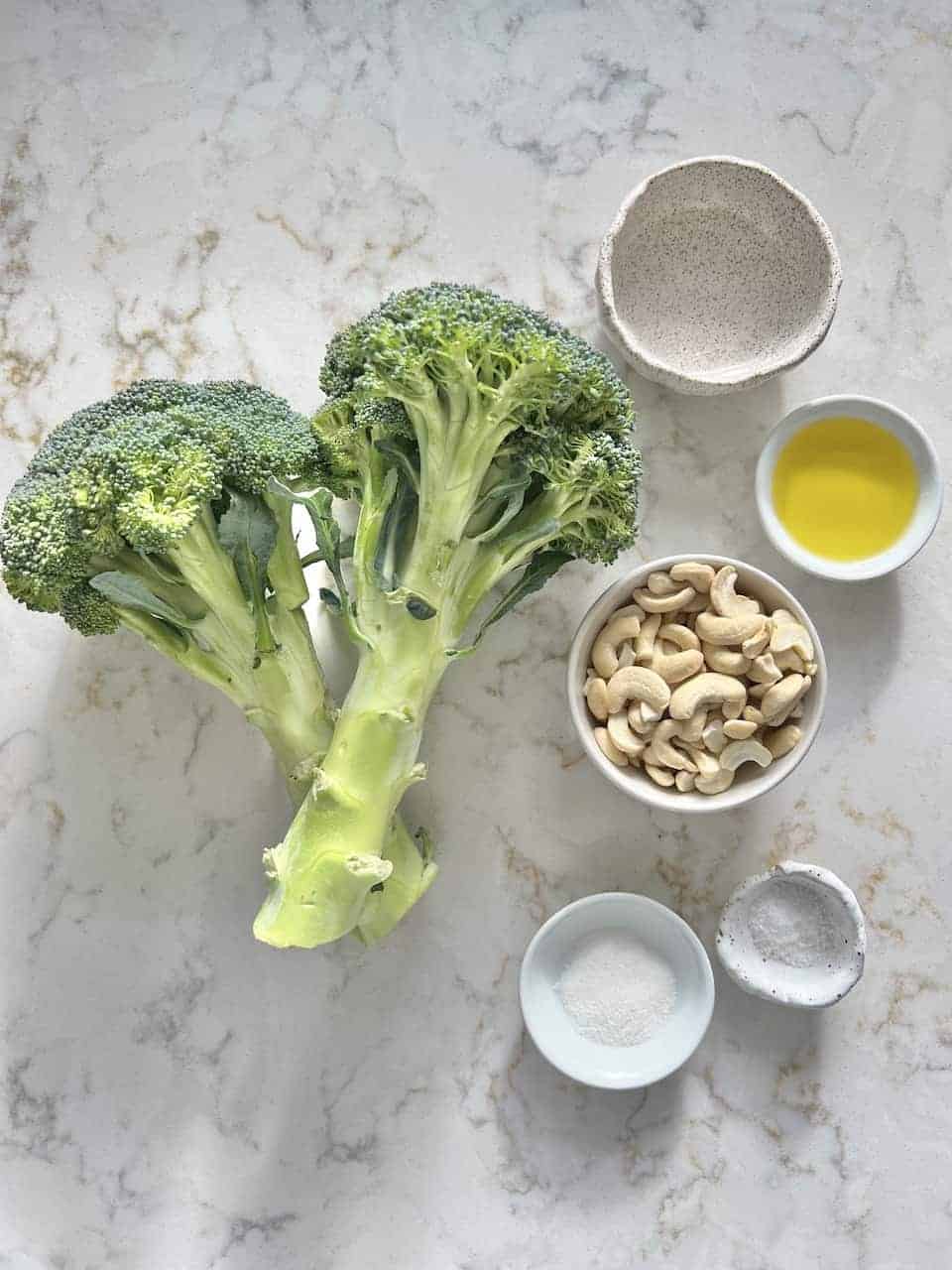 ingredients for Roasted Curried Broccoli measured out against a white surface