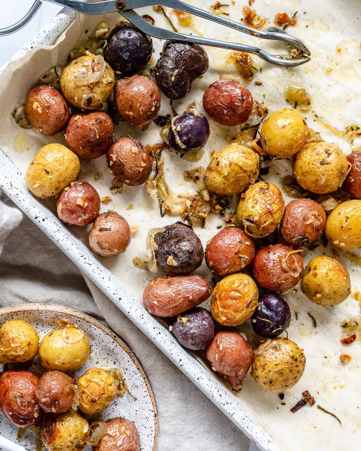 completed Roasted Rosemary Potatoes in a white tray