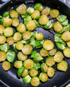 process of brussels sprouts being roasted in pan