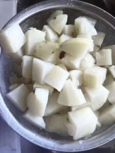 cut up potatoes in a large bowl