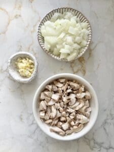 measured out ingredients in a bowl against white background