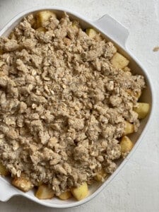 pre bakedmixture of apple and oat mixture in a baking dish