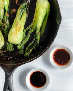 process showing measured out sauces alongside skillet with baby bok choy