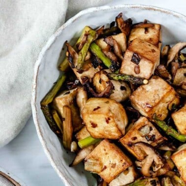 finished Shiitake Asparagus Tofu Stir-fry plated on a white plate