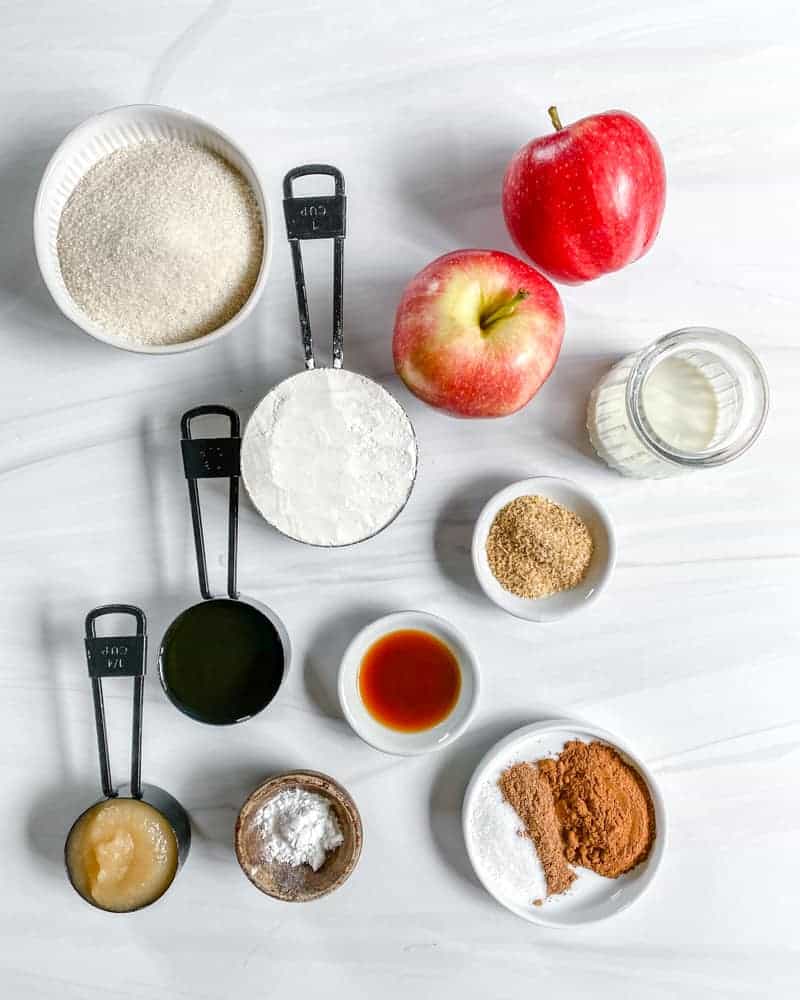 Vegan Apple Cake Ingredients measured out against a white marble surface