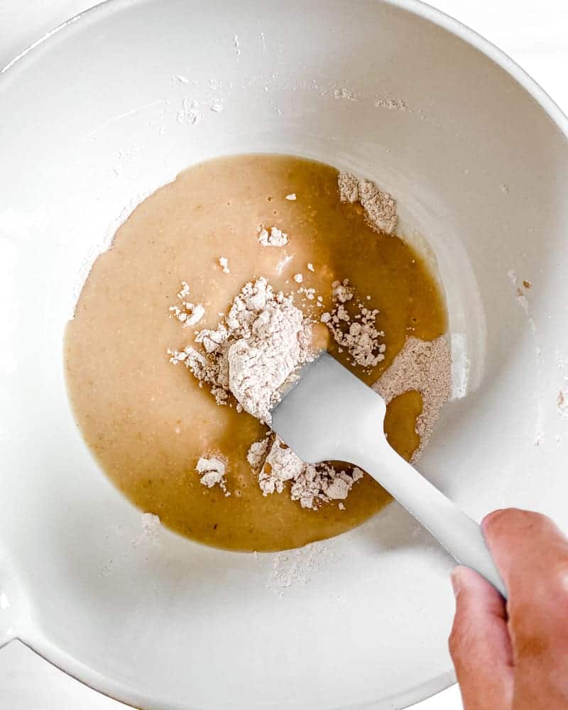 process of mixing ingredients in bowl for apple cake