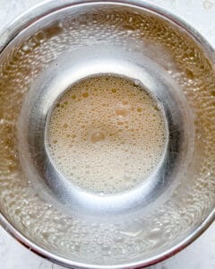 process of dissolving yeast in bowl