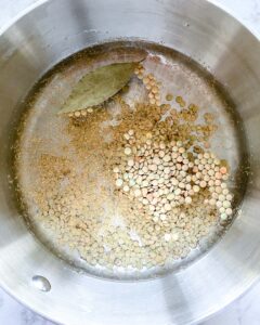 process of putting ingredients into stainless steel bowl