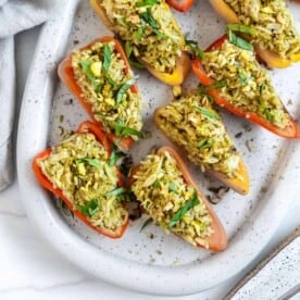 finished Stuffed Roasted Sweet Peppers plated on a white tray