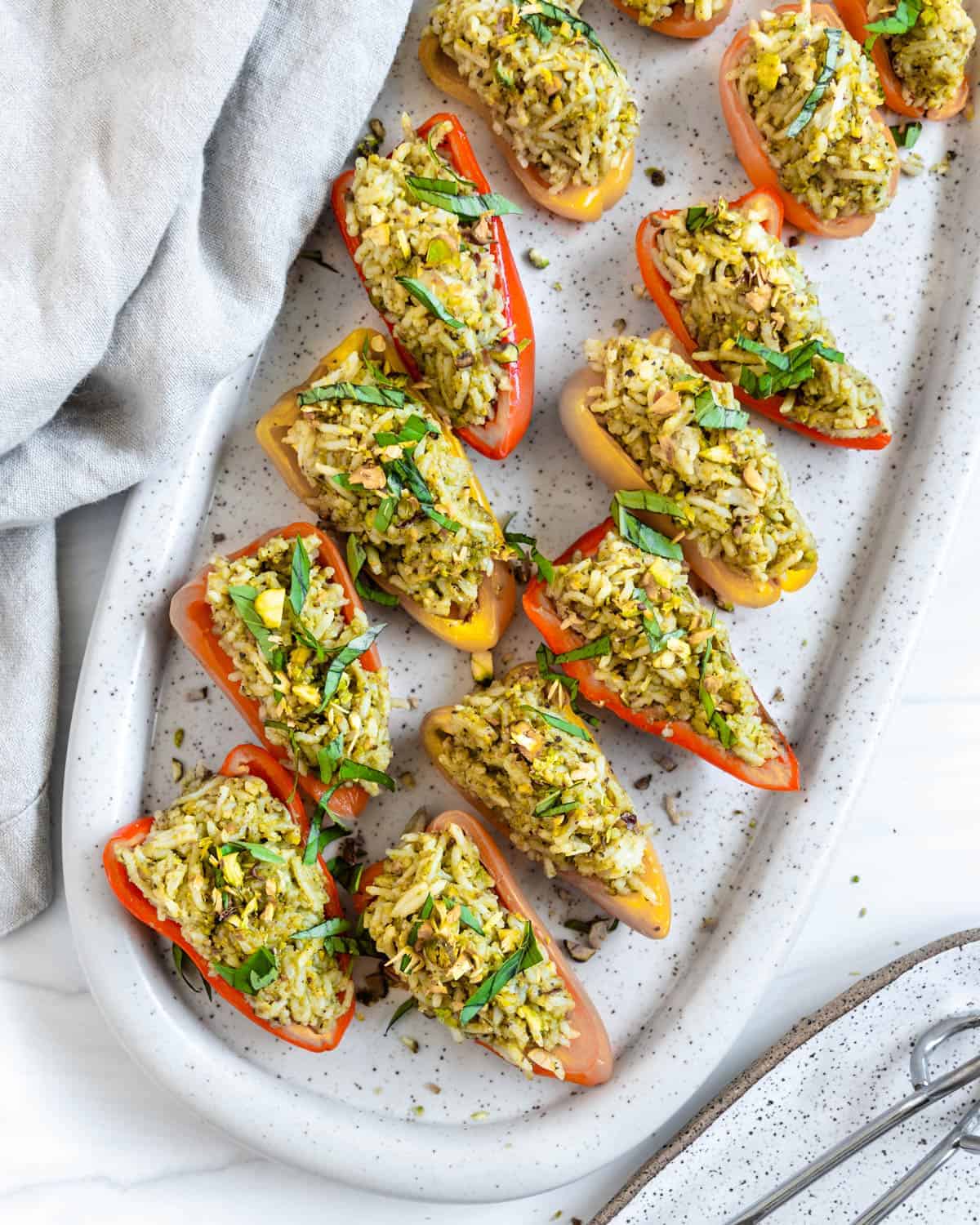 finished Stuffed Roasted Sweet Peppers plated on a white tray