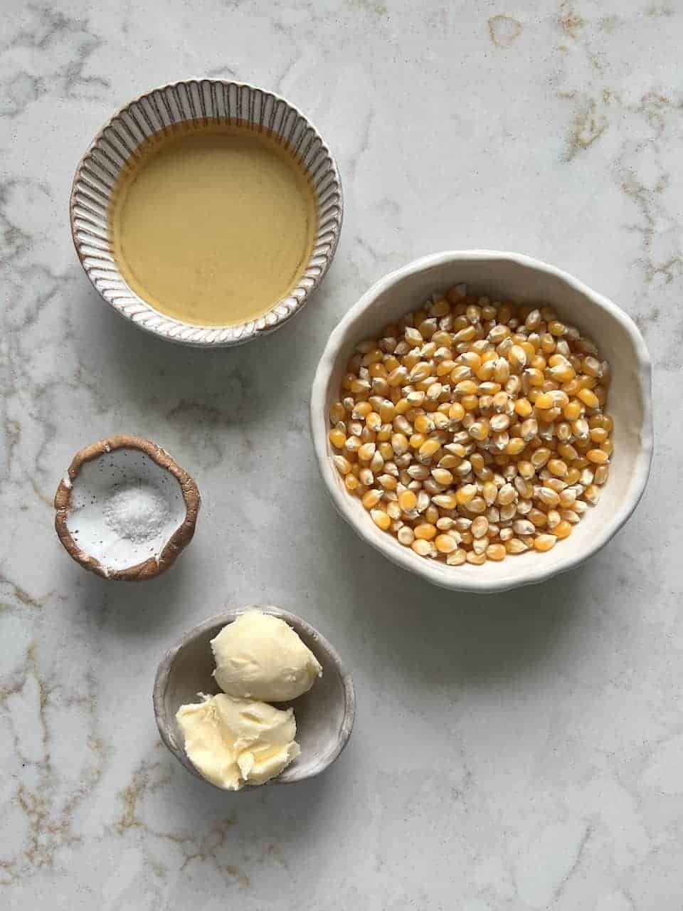 ingredients for Sweet and Salty Popcorn against a white background