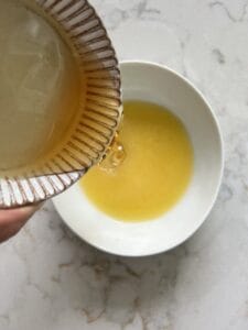 process of adding agave syrup into bowl