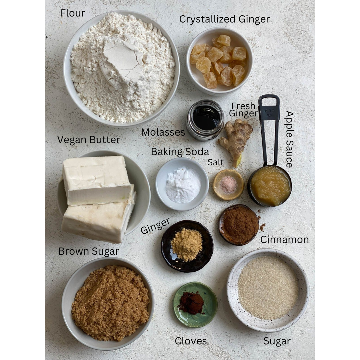 ingredients for Triple Ginger Cookies measured out against a white surface