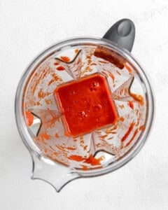process shot of peppers post being blended in a blender