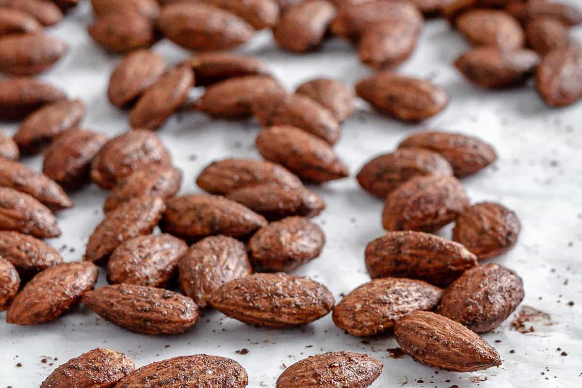 completed cinnamon almonds against a white surface