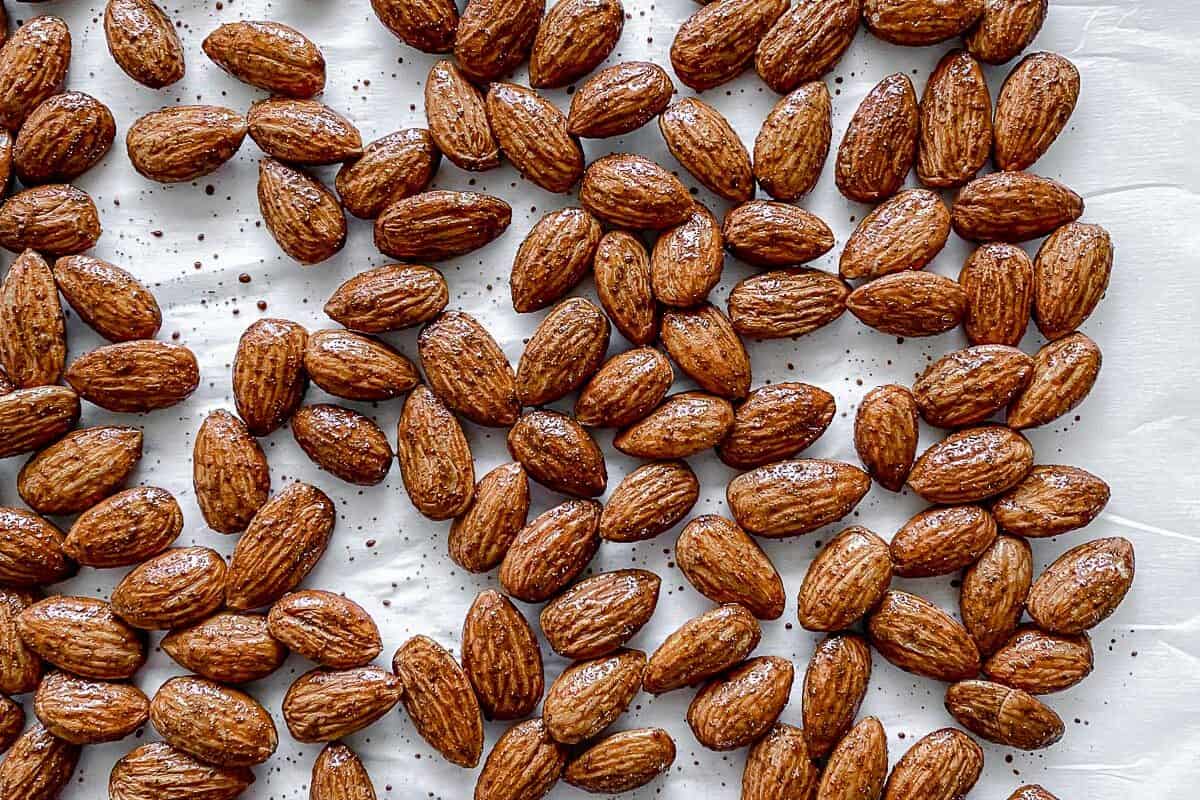 completed cinnamon almonds against a white surface