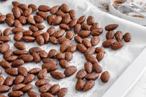 completed cinnamon almonds against a white surface