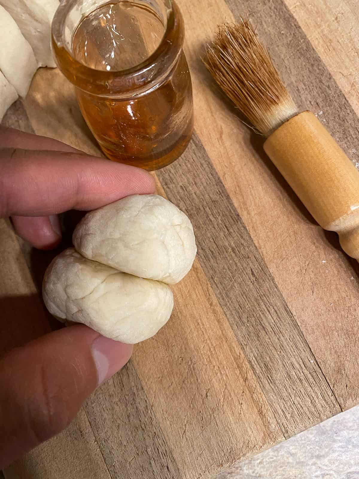 process shot of putting two balls of dough together