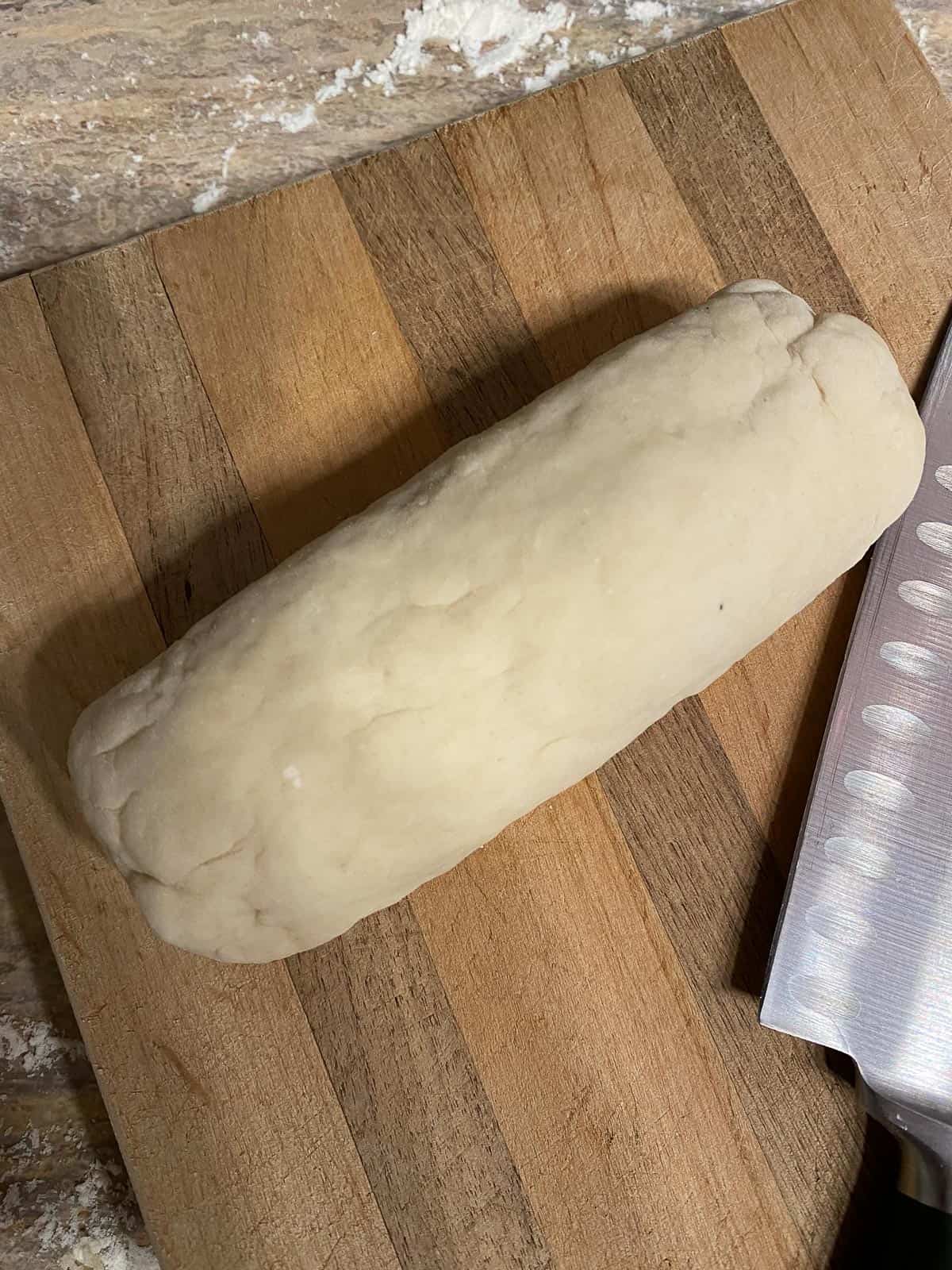 process shot of formed dough on cutting board