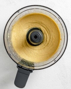 process shot of dip being processed in food processor