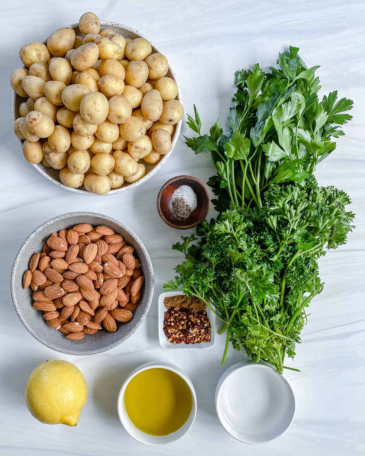 ingredients for parsley potatoes against a white background