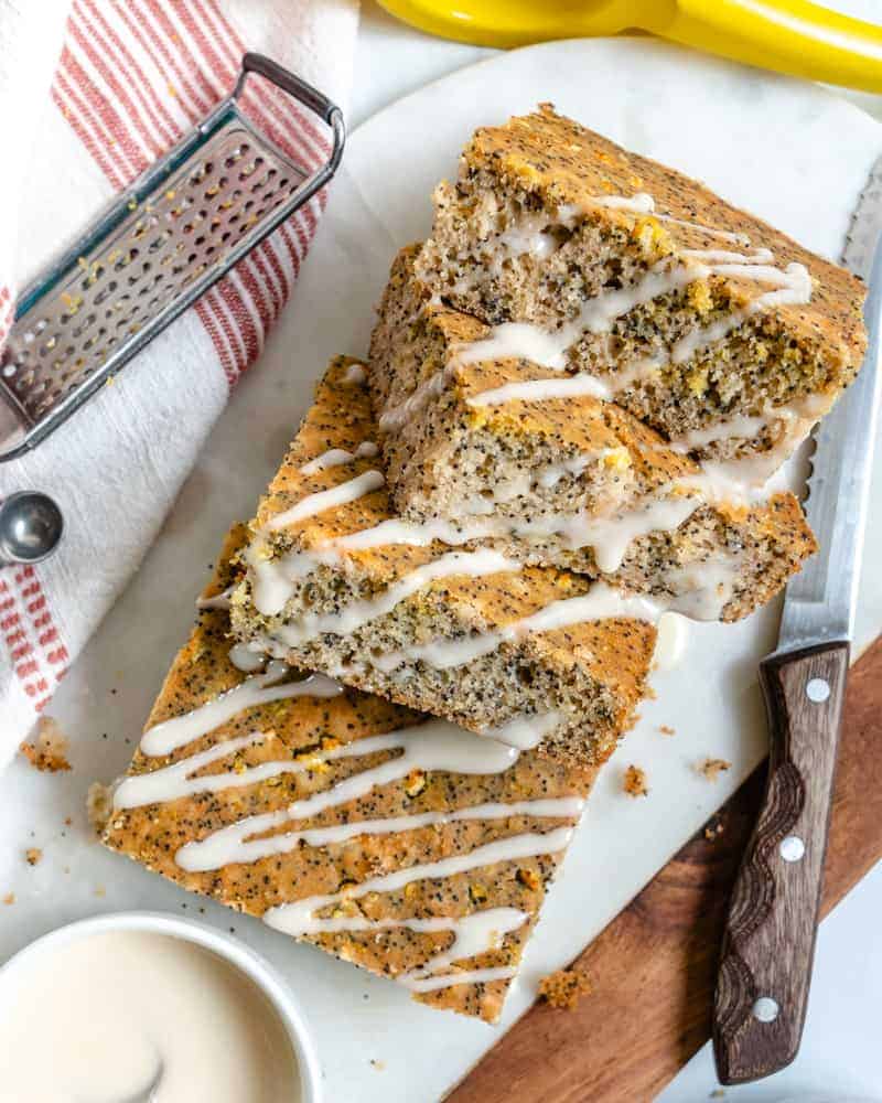 completed lemon poppy seed cake in four squares on a white platter