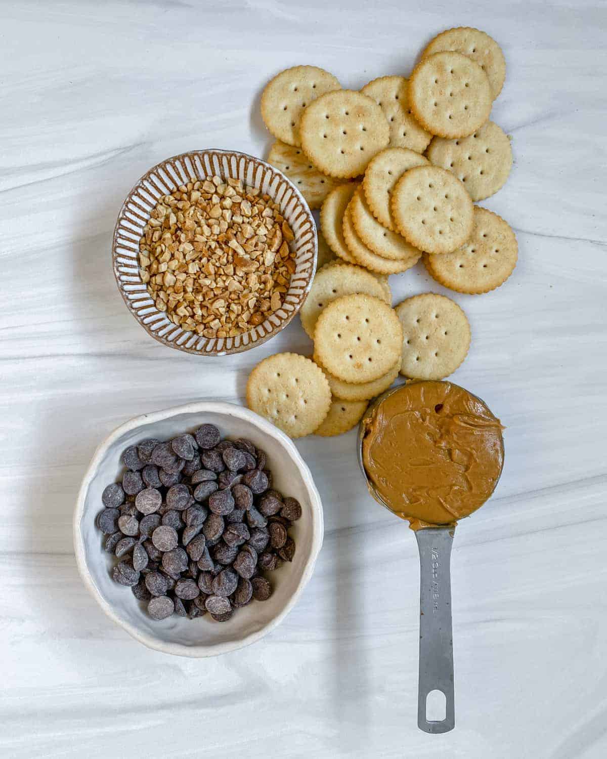 ingredients for Peanut Butter Cracker Sandwiches against a white surface