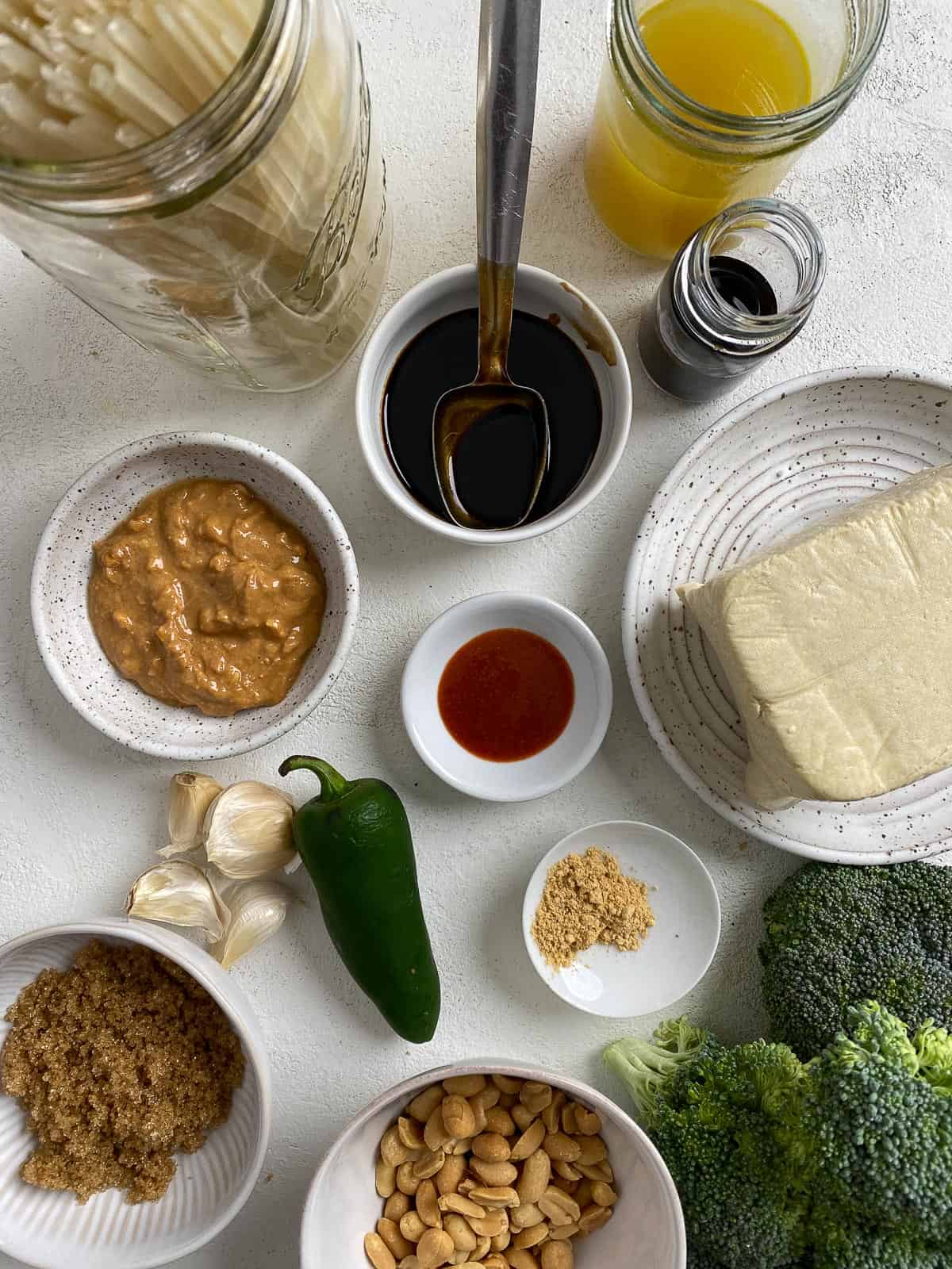 ingredients for Tofu Pad Thai measured out against a light surface