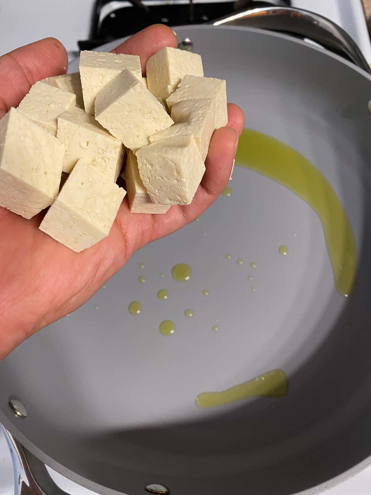 process of adding tofu to pan