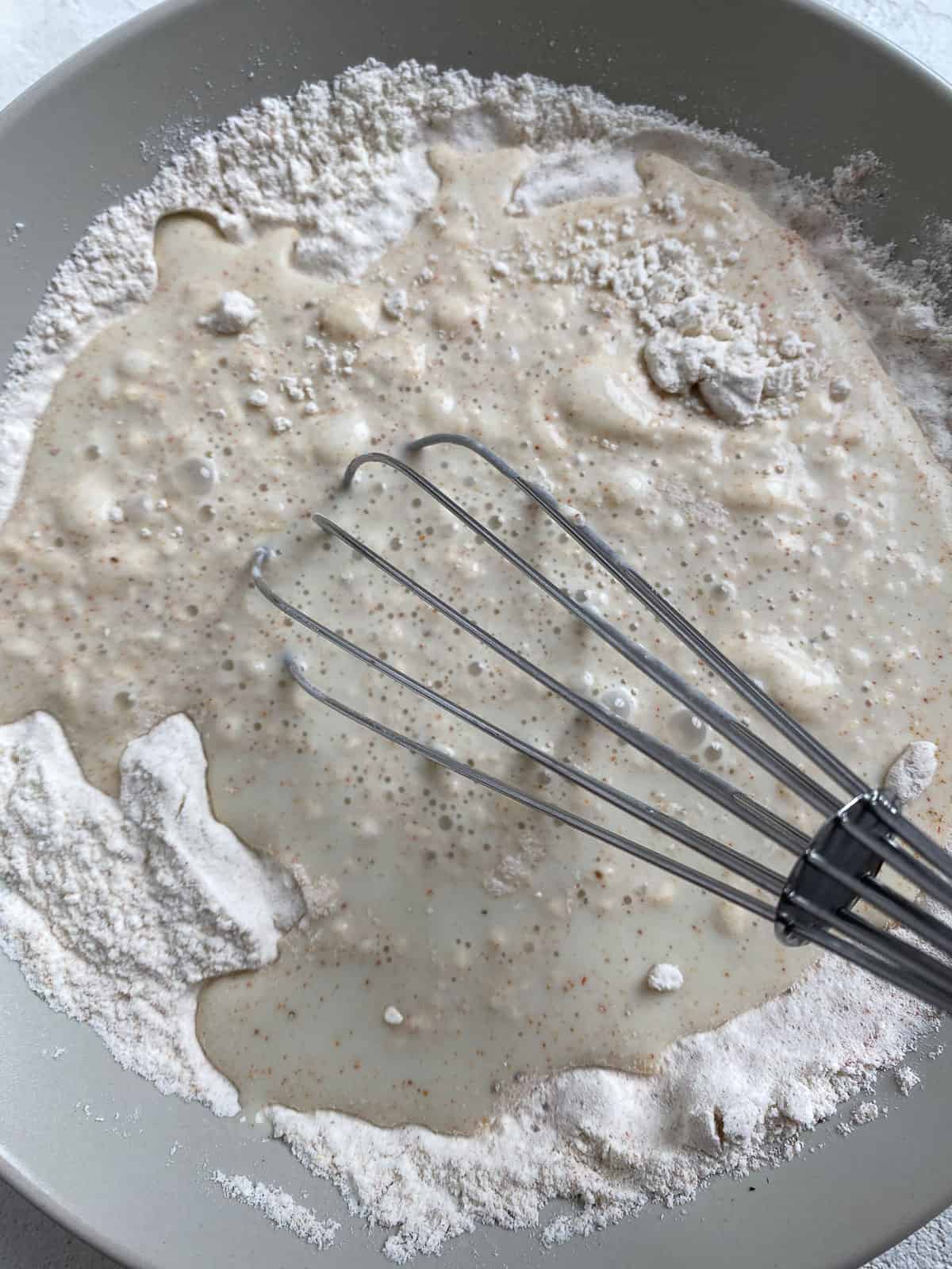 process shot of mixing flour mixture in bowl