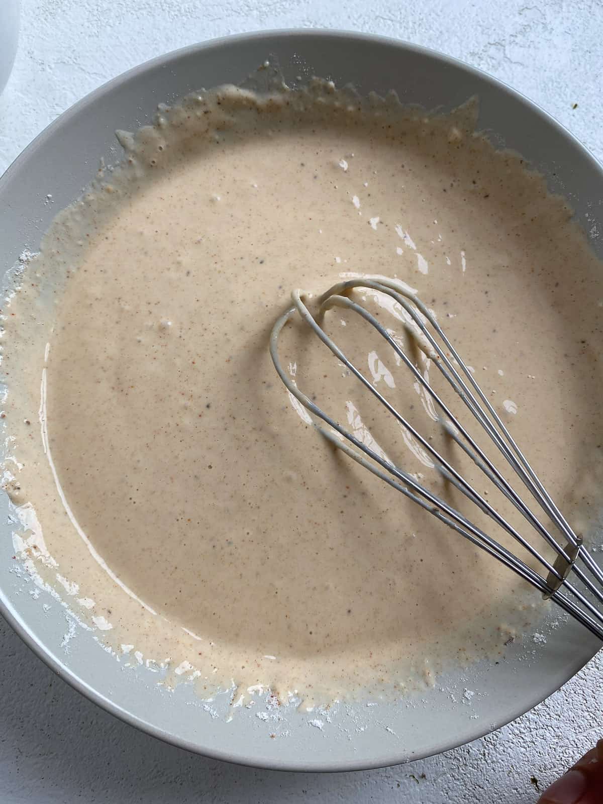 process shot of mixing flour mixture in bowl