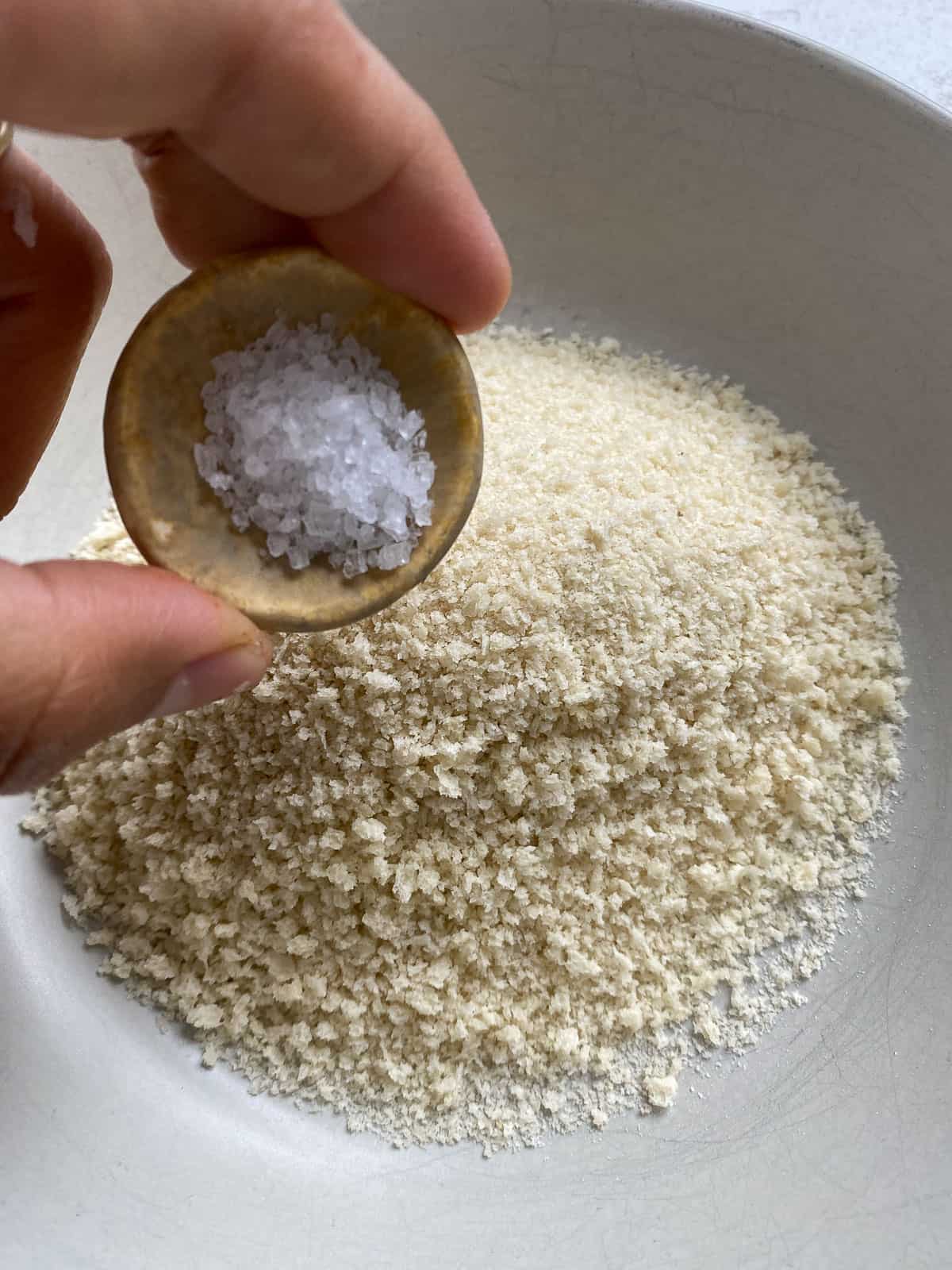 process shot of adding salt to bowl