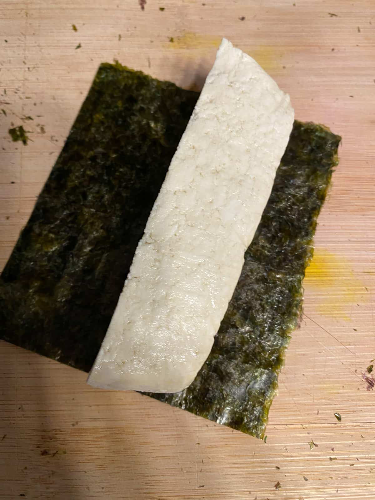 process shot of adding tofu to nori sheet
