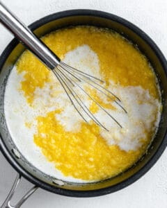process shot of mixing pie filling in black pan