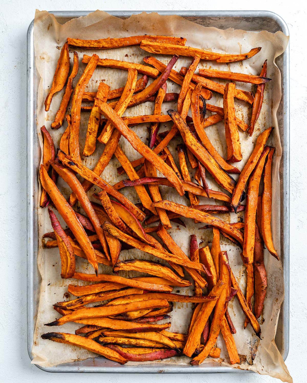 post cooked sweet potato fries in a baking tray